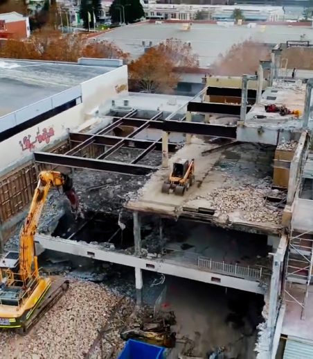 Rubble and scaffolding at the Fremantle high rise demolition site showing the stories being taken apart with machinery on each level