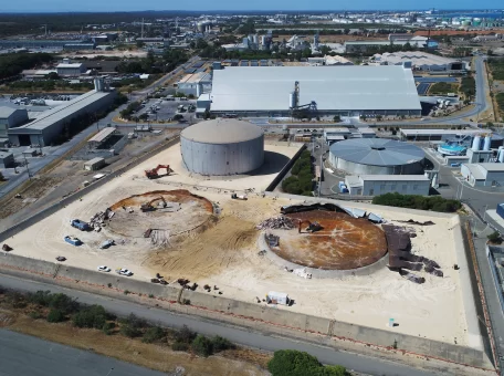 Far wide shot of the strategic demolition of the steel oil tanks on the live Kwinana Synergy site showing two tanks demolished.