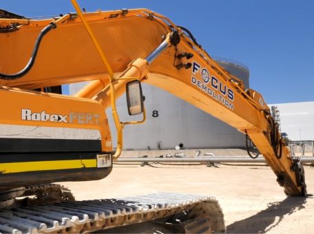 Yellow excavator with logo for Focus Demolition, Perth's leading commercial and industrial demolition company