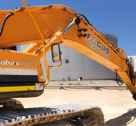 Yellow excavator with logo for Focus Demolition, Perth's leading commercial and industrial demolition company