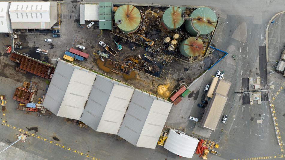 Birds eye view of heavy machinery at work at the Sami Bitumen Plant in North Fremantle demolishing an aging tank.